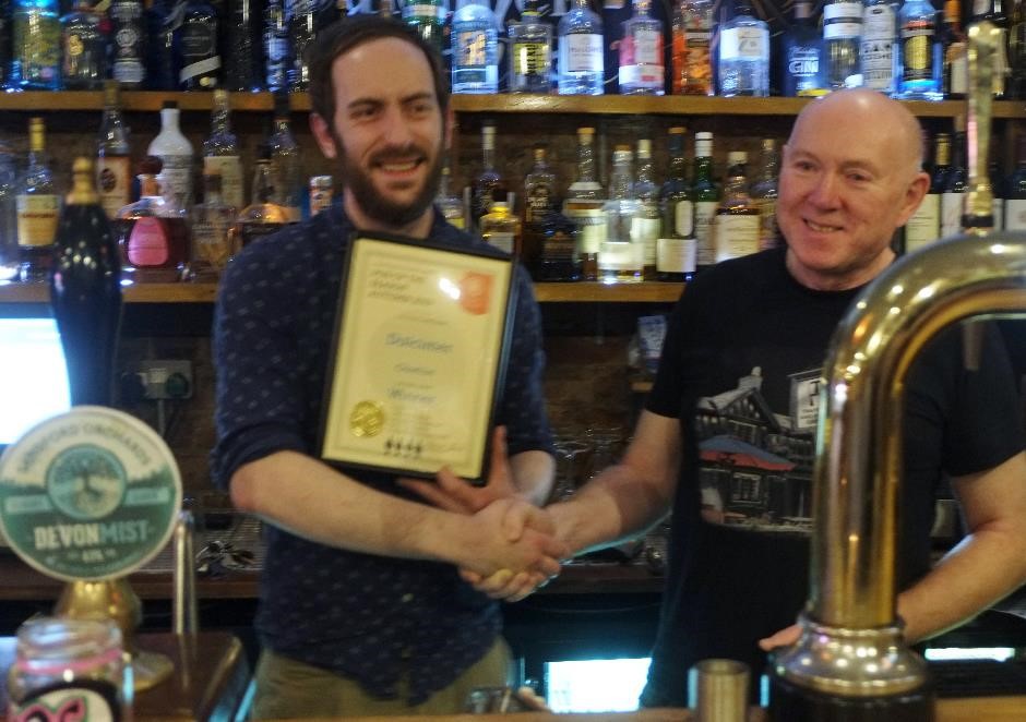 George presenting the award to Chris